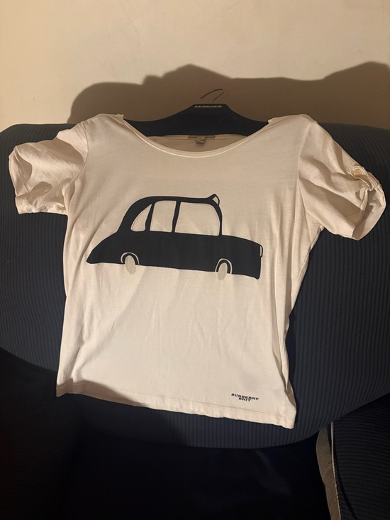 Burberry Tops - Burberry Cream Short Sleeve Tee with Black Car Graphic